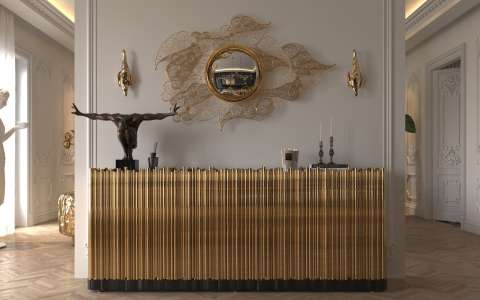 It's an entrance with a sideboard, a mirrored watermark, the walls are white, and there's a statue.