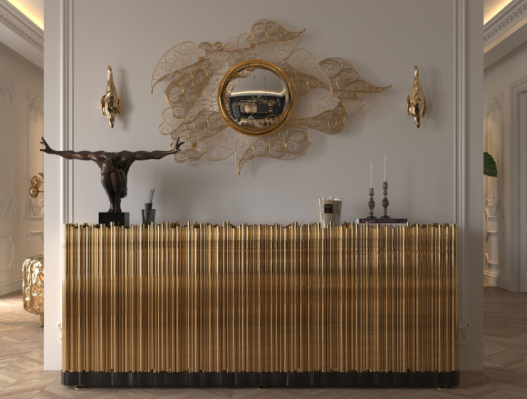 It's an entrance with a sideboard, a mirrored watermark, the walls are white, and there's a statue.